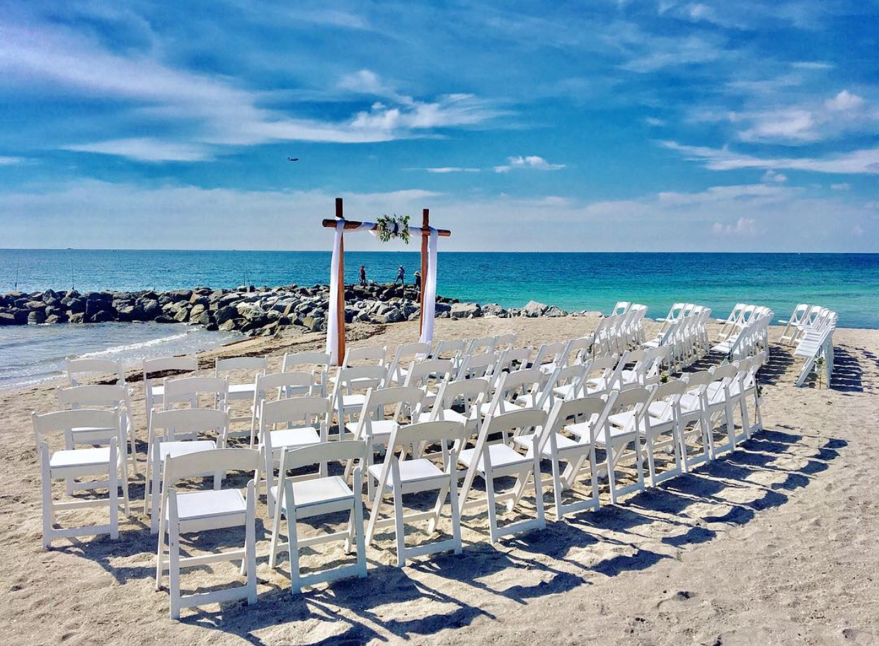 An beachfront wedding reception set up